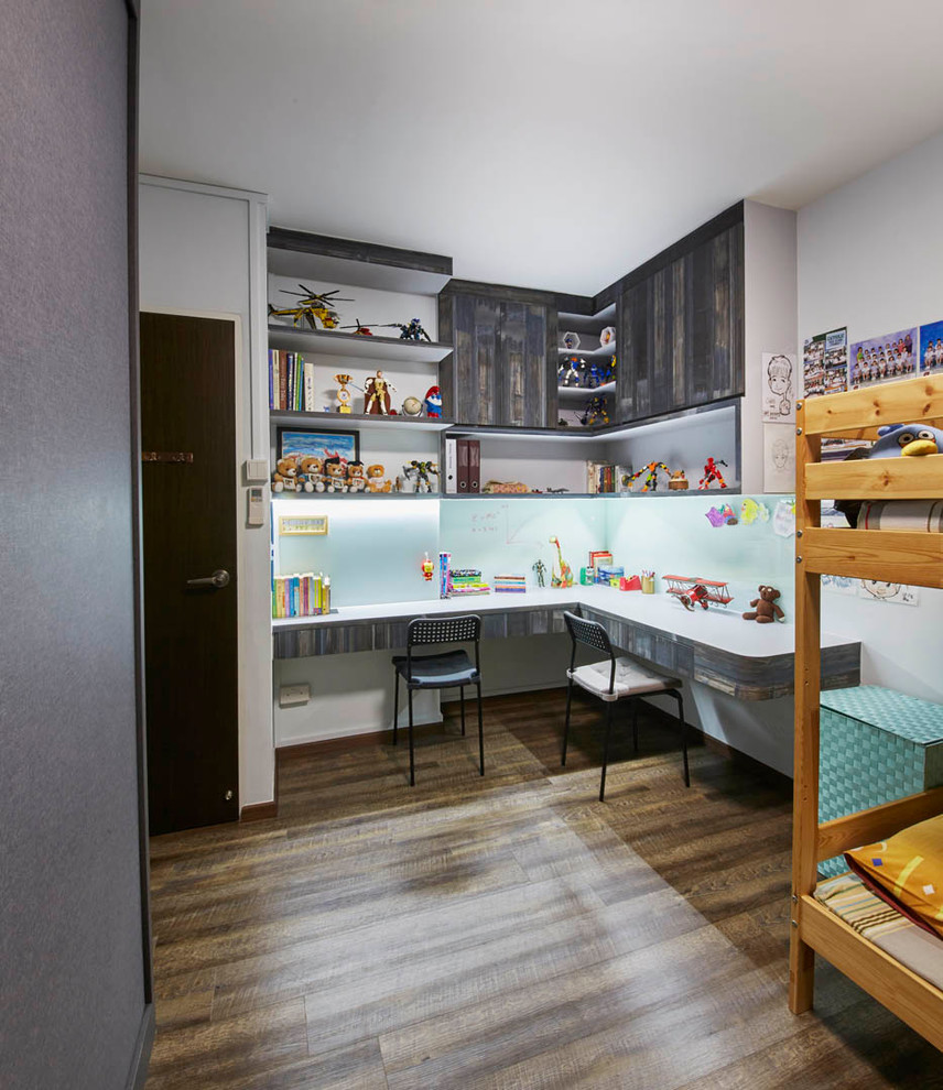 This is an example of a mid-sized scandinavian kids' room in Singapore with beige walls and dark hardwood floors.