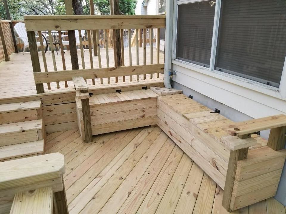 Example of a large mountain style backyard deck design in Austin