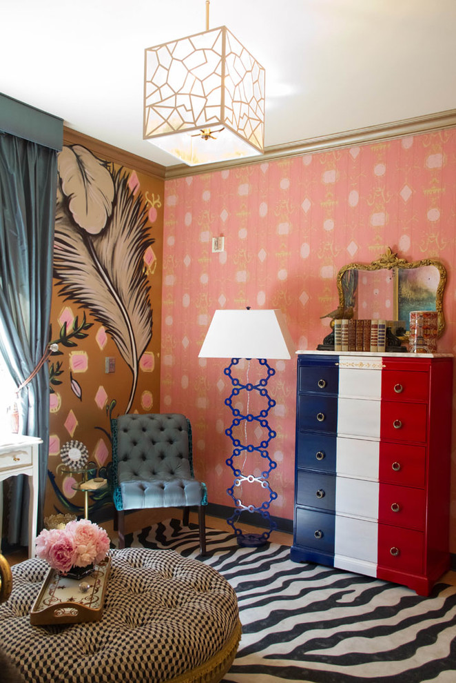 Photo of an eclectic bedroom in Los Angeles with pink walls.