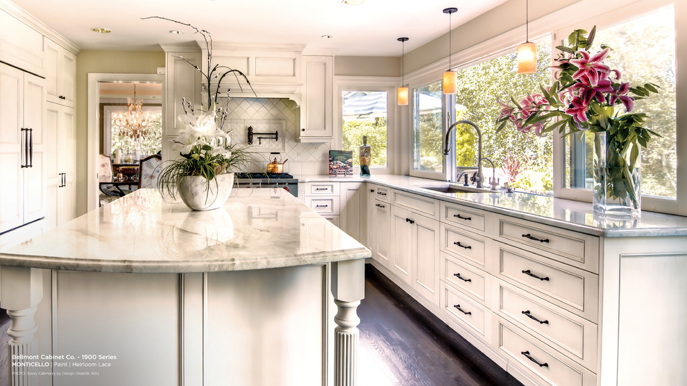 This is an example of a traditional kitchen in San Francisco with recessed-panel cabinets and white cabinets.