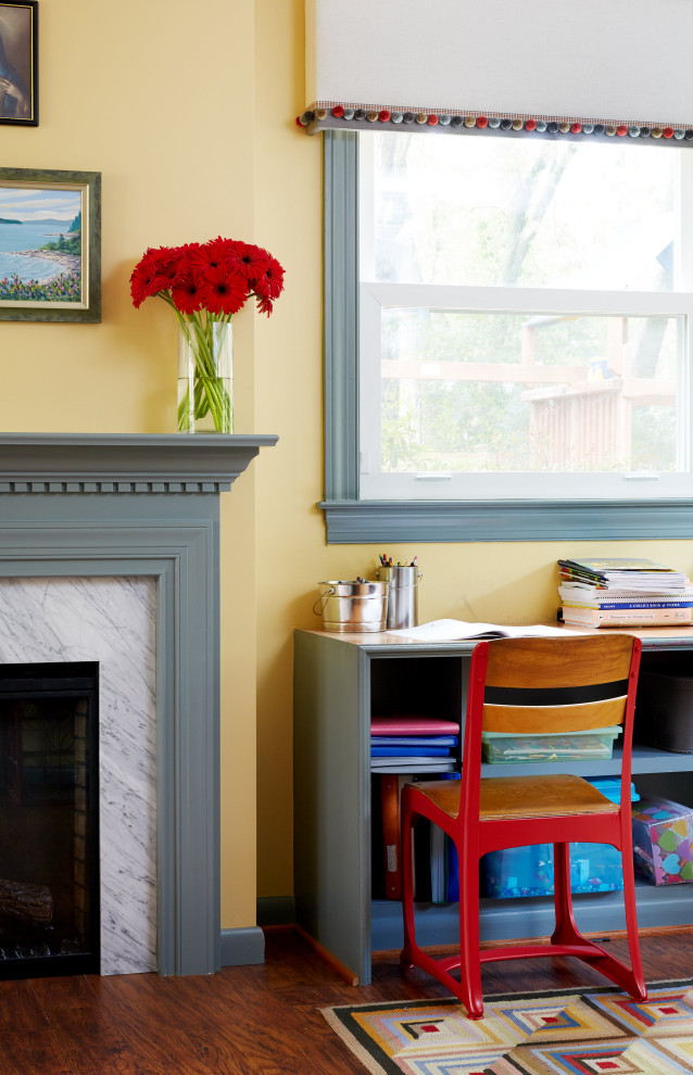 Inspiration for a large transitional gender-neutral brown floor and dark wood floor kids' room remodel in DC Metro with yellow walls