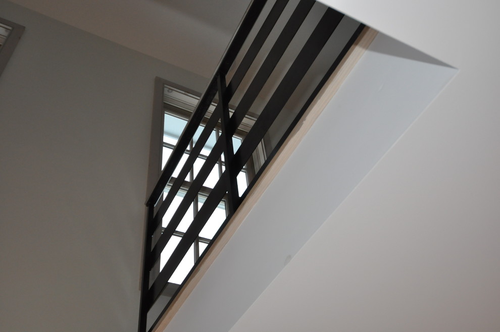 Staircase - mid-sized transitional wooden curved open and metal railing staircase idea in Boston