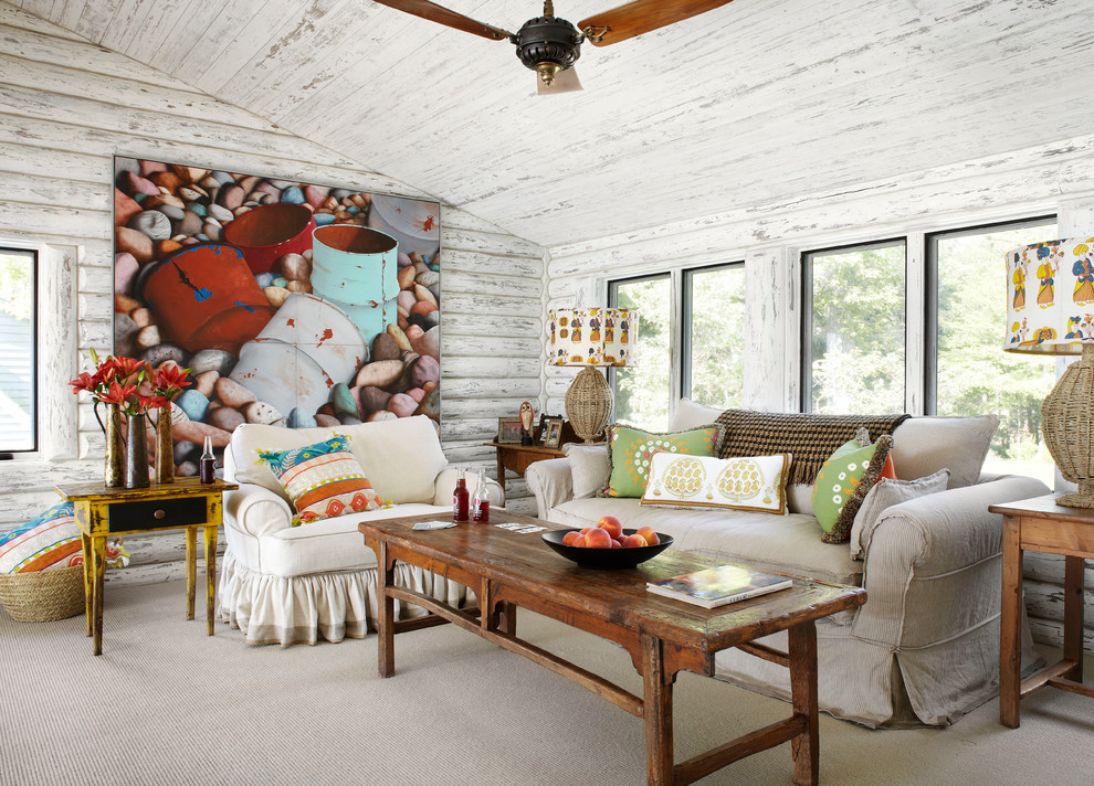 Inspiration for a country family room in Milwaukee with white walls and carpet.