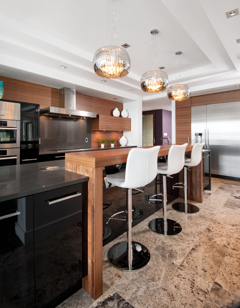 Photo of a large contemporary l-shaped open plan kitchen in Ottawa with stainless steel appliances, flat-panel cabinets, medium wood cabinets, brown splashback, timber splashback, limestone floors, with island and beige floor.