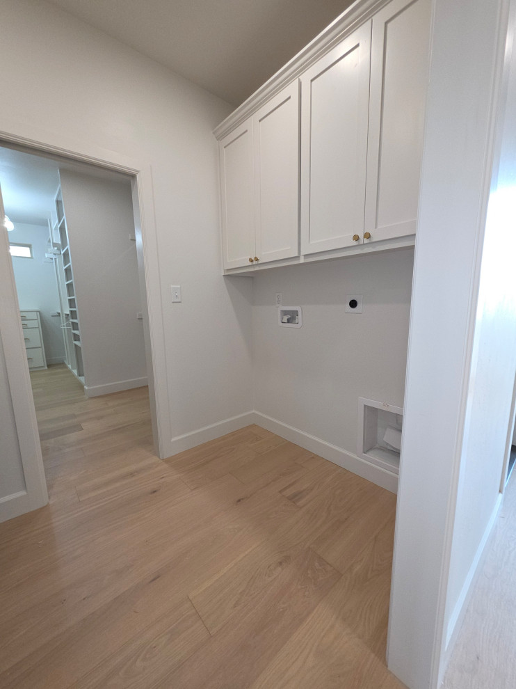 Laundry room sits off the Primary/Master Closet & Main House