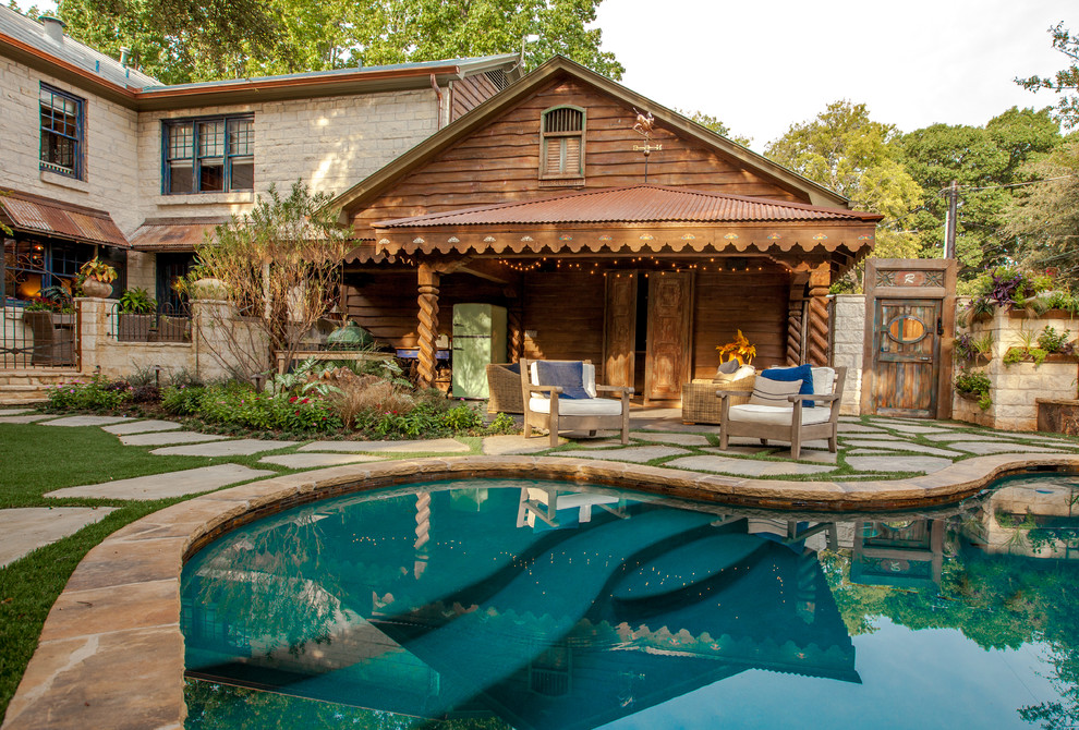 Design ideas for a country pool in Dallas with natural stone pavers.
