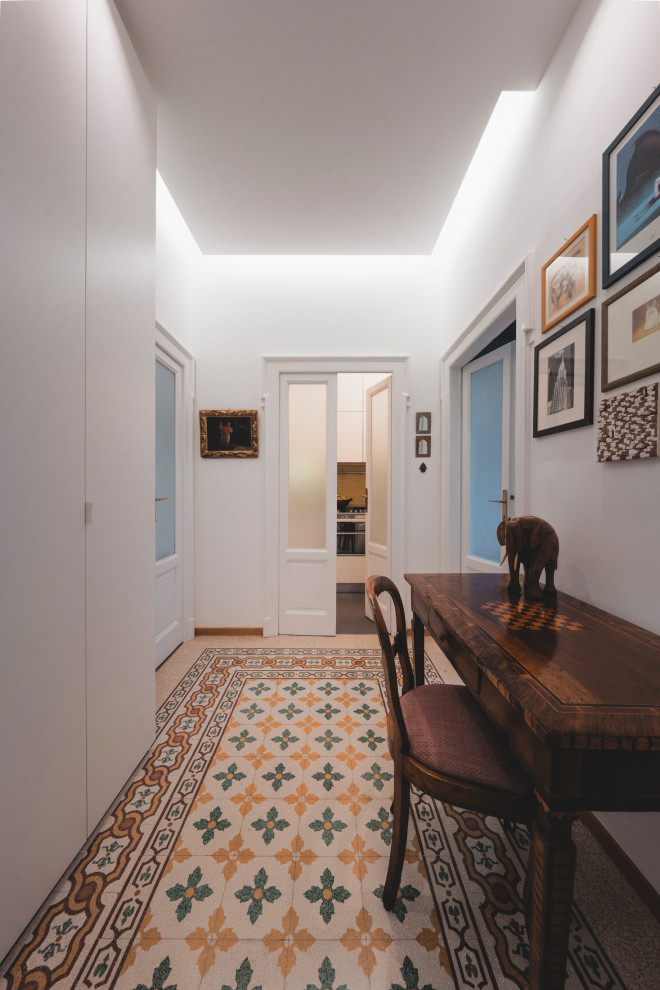 Inspiration for a medium sized classic foyer in Milan with white walls, marble flooring, a white front door and multi-coloured floors.