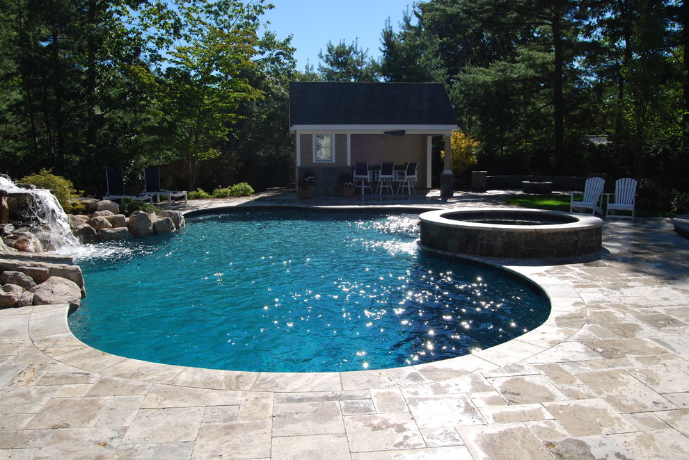 Example of a mid-sized mountain style backyard stone and kidney-shaped natural water slide design in Boston