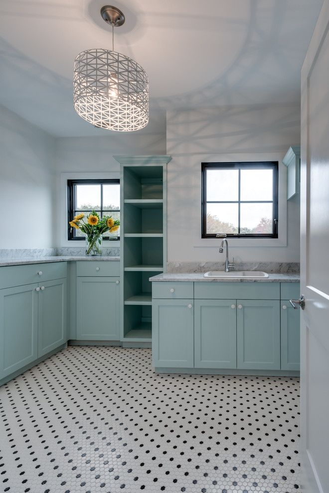 This is an example of a transitional laundry room in Chicago.
