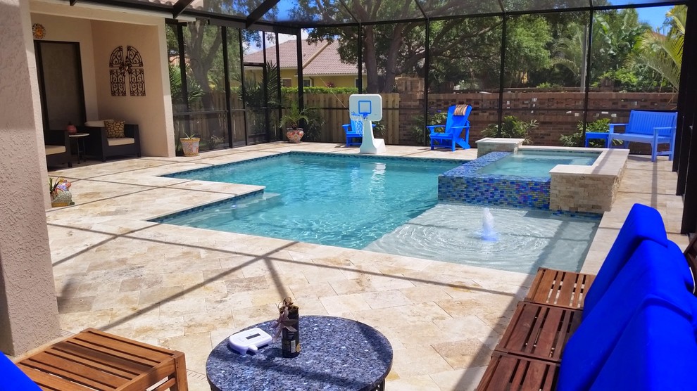 Large modern backyard custom-shaped lap pool in Tampa with a hot tub.