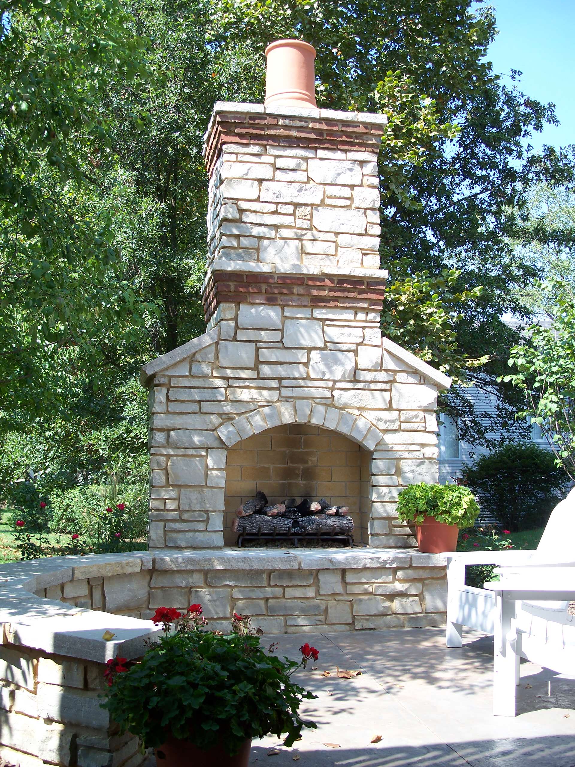 Lake St Louis, Missouri Outdoor Stone Masonry (Gas) fireplace with Brick Banding