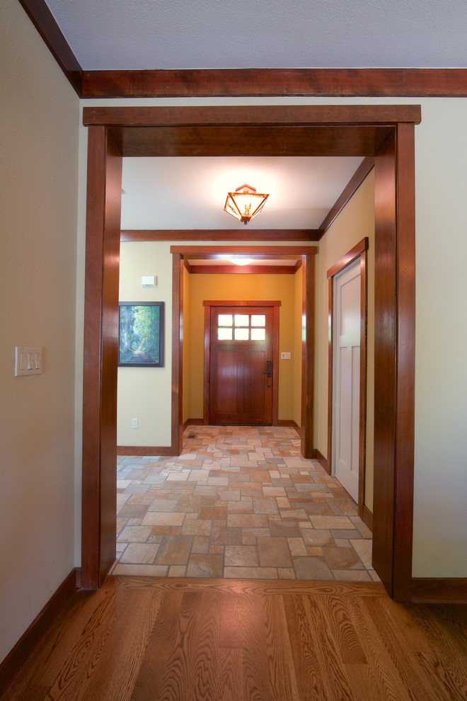 Inspiration for a small arts and crafts foyer in San Francisco with ceramic floors, a single front door and a dark wood front door.