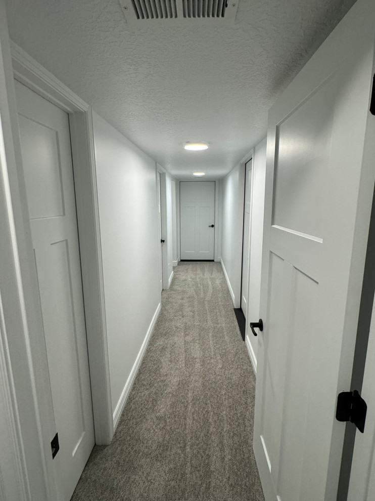 Long hallway outside of bathroom and laundry room. also two cold storage rooms.