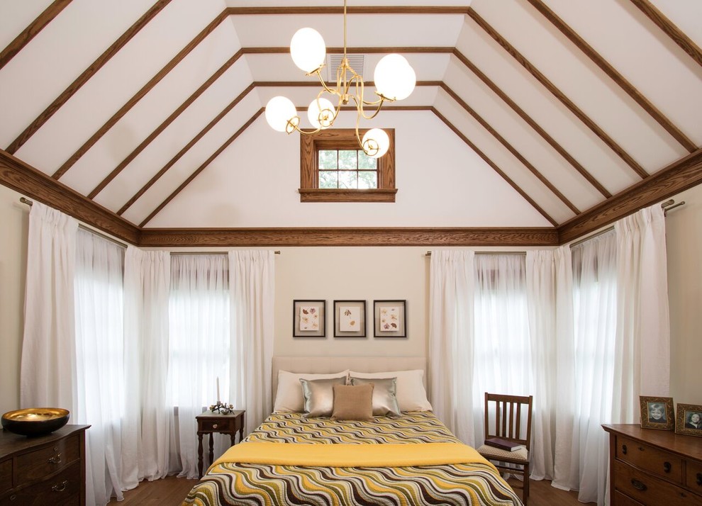 Inspiration for a mid-sized transitional master bedroom in New York with white walls, medium hardwood floors and brown floor.