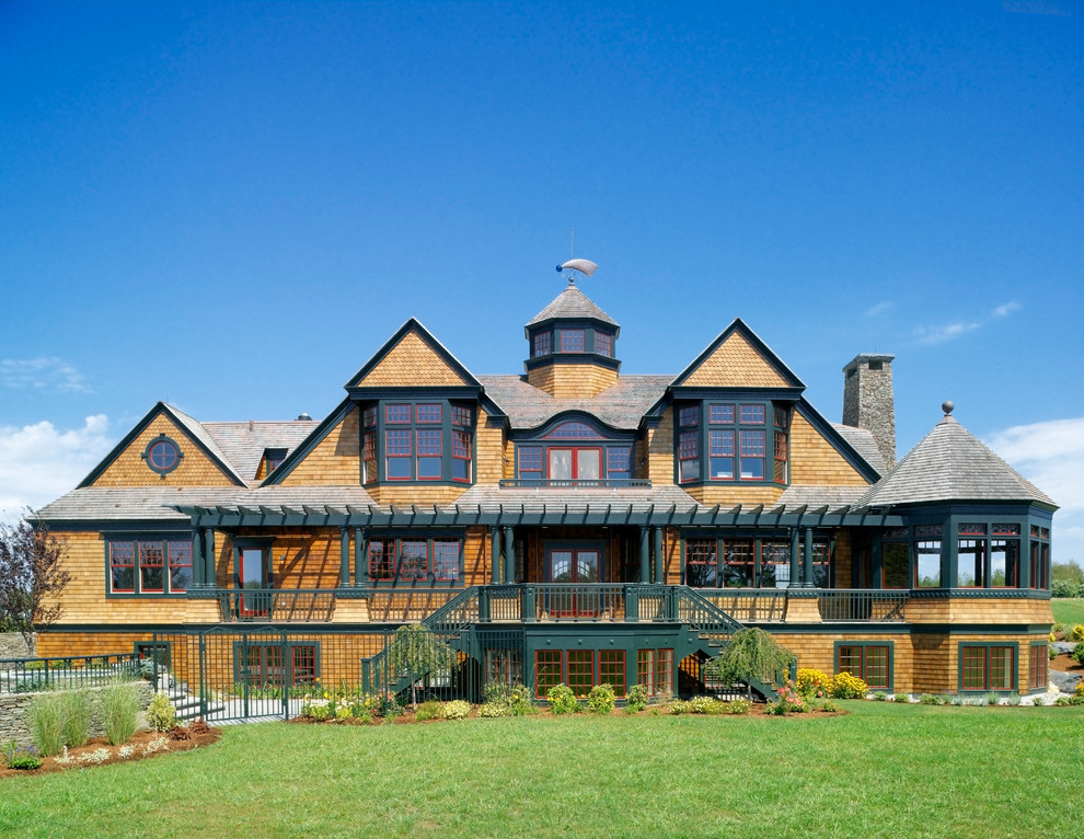 Inspiration for an expansive traditional three-storey brown exterior in Providence with a gable roof and wood siding.