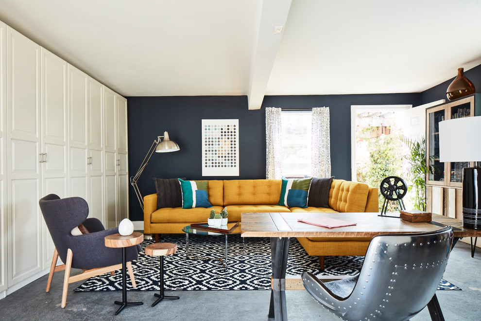 Home office - large contemporary freestanding desk concrete floor and gray floor home office idea in New York with gray walls