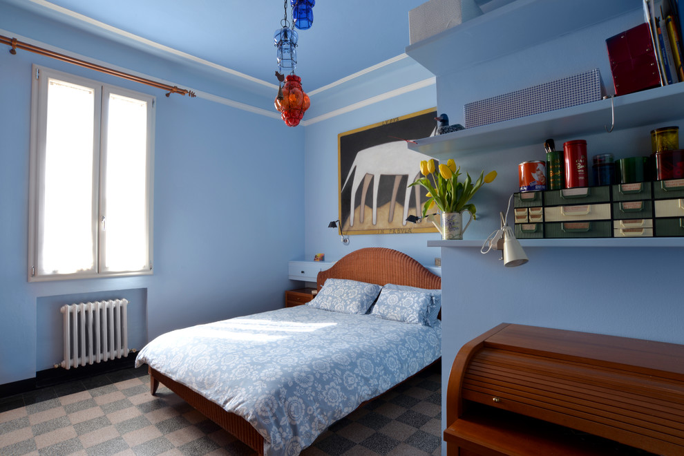 Photo of a large midcentury master bedroom in Bologna with blue walls and ceramic floors.
