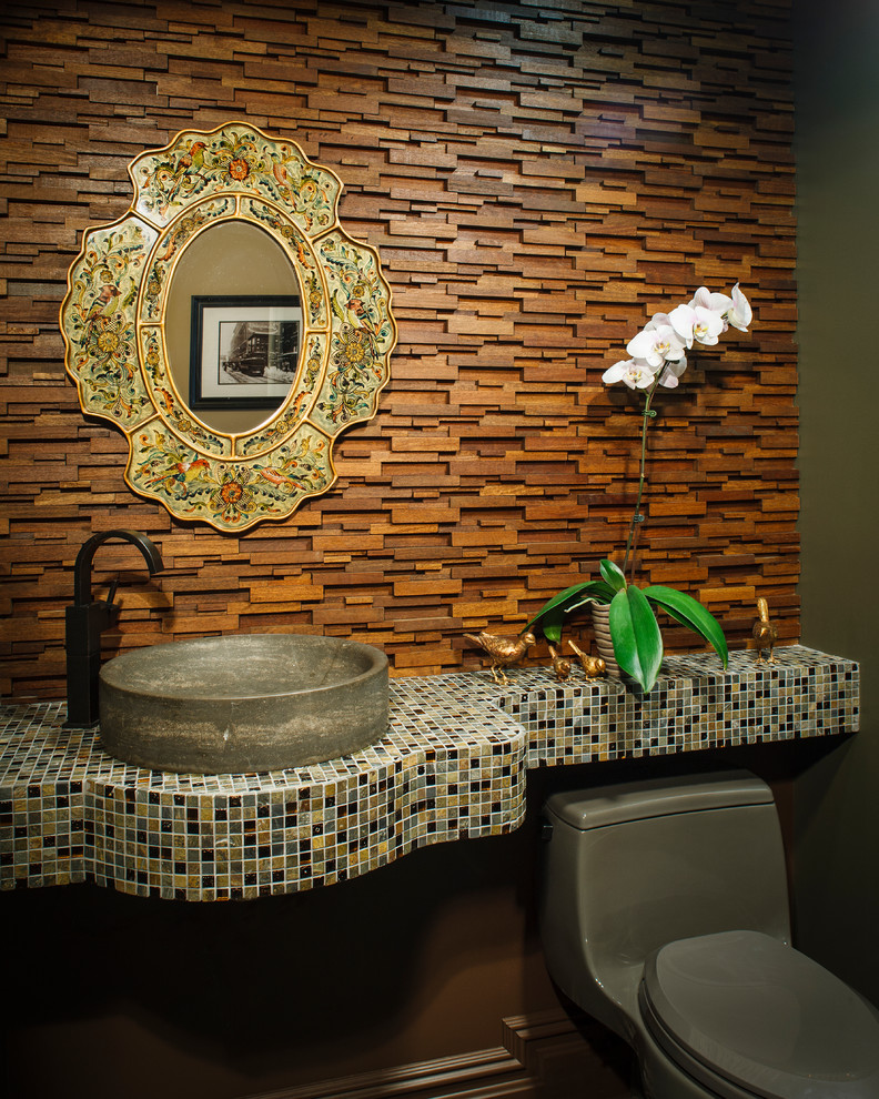 Photo of a contemporary powder room in New York with a vessel sink and tile benchtops.