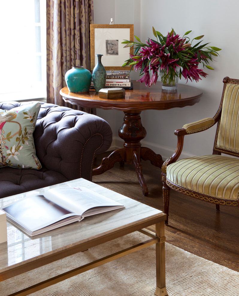 Elegant enclosed medium tone wood floor family room library photo in Chicago with gray walls