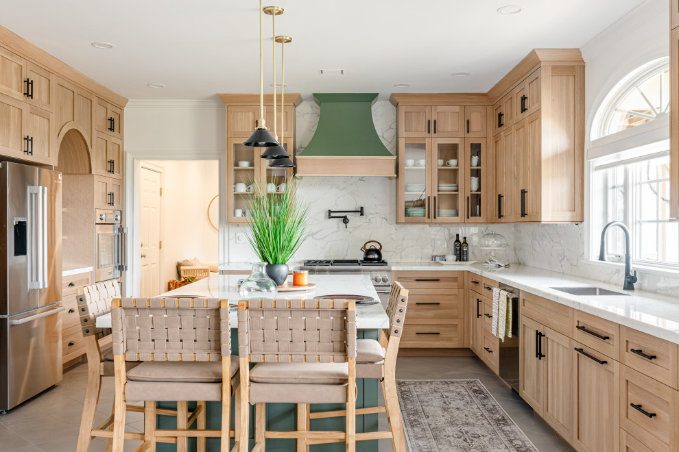 Kitchen - mid-sized country u-shaped ceramic tile and gray floor kitchen idea in Philadelphia with an undermount sink, light wood cabinets, marble countertops, white backsplash, marble backsplash, stainless steel appliances, an island, white countertops and shaker cabinets