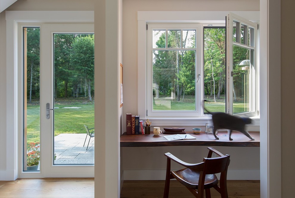 Inspiration for a small country built-in desk home office remodel in Boston