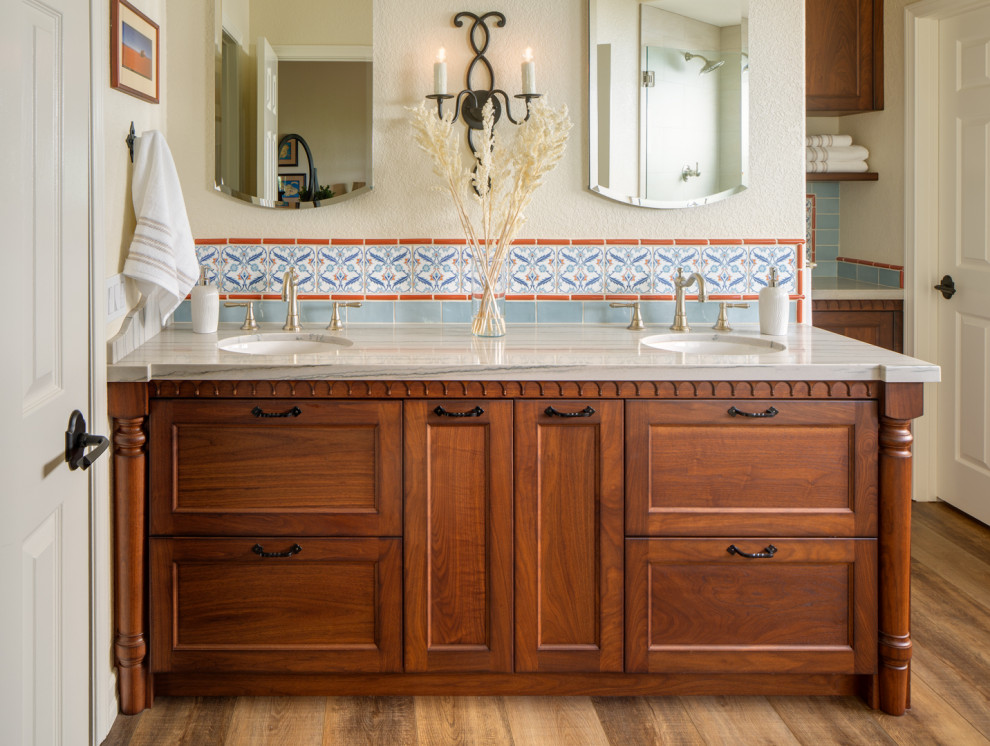Photo of a large traditional master bathroom in San Diego with furniture-like cabinets, a freestanding tub, a double vanity and a built-in vanity.