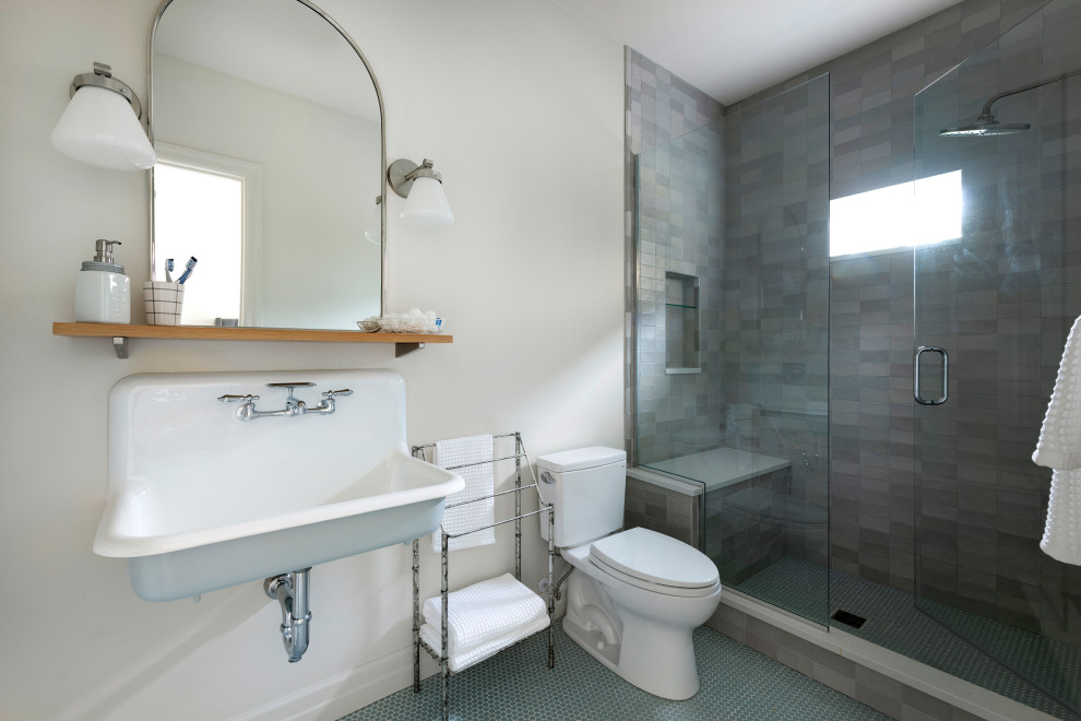 Inspiration for an expansive traditional grey and teal shower room bathroom in Minneapolis with white cabinets, grey tiles, a wall-mounted sink, a hinged door, white worktops, a shower bench, a single sink, a floating vanity unit, a double shower, a two-piece toilet, ceramic tiles, white walls, mosaic tile flooring and blue floors.