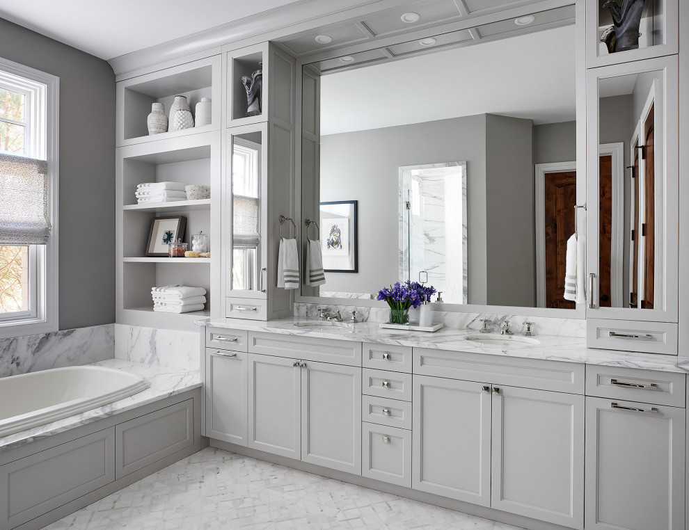 Huge transitional master white tile and marble tile marble floor, white floor and double-sink bathroom photo in Chicago with beaded inset cabinets, gray cabinets, gray walls, an undermount sink, marble countertops, a hinged shower door, white countertops and a built-in vanity