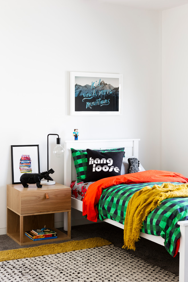 Photo of a contemporary gender-neutral kids' bedroom for kids 4-10 years old in Melbourne with white walls, carpet and grey floor.