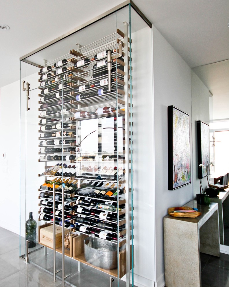 Inspiration for a mid-sized contemporary wine cellar in Montreal with ceramic floors and storage racks.