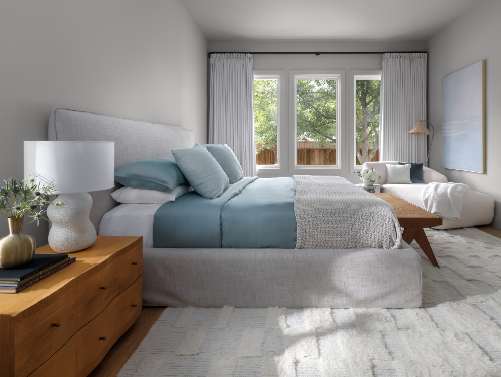 Example of a transitional bedroom design in Dallas