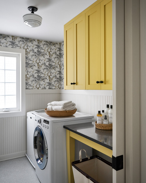 Mid-sized farmhouse galley ceramic tile, white floor and wallpaper dedicated laundry room photo in Chicago with shaker cabinets, yellow cabinets, quartz countertops, beige backsplash, shiplap backsplash, beige walls, a side-by-side washer/dryer and black countertops