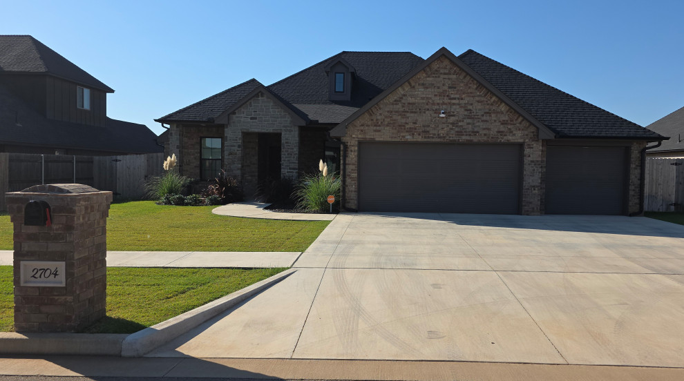 Natural brick exterior with dark roof