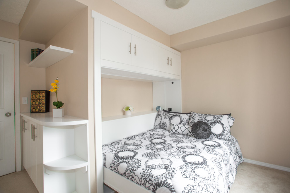 This is an example of a small transitional guest bedroom in Calgary.
