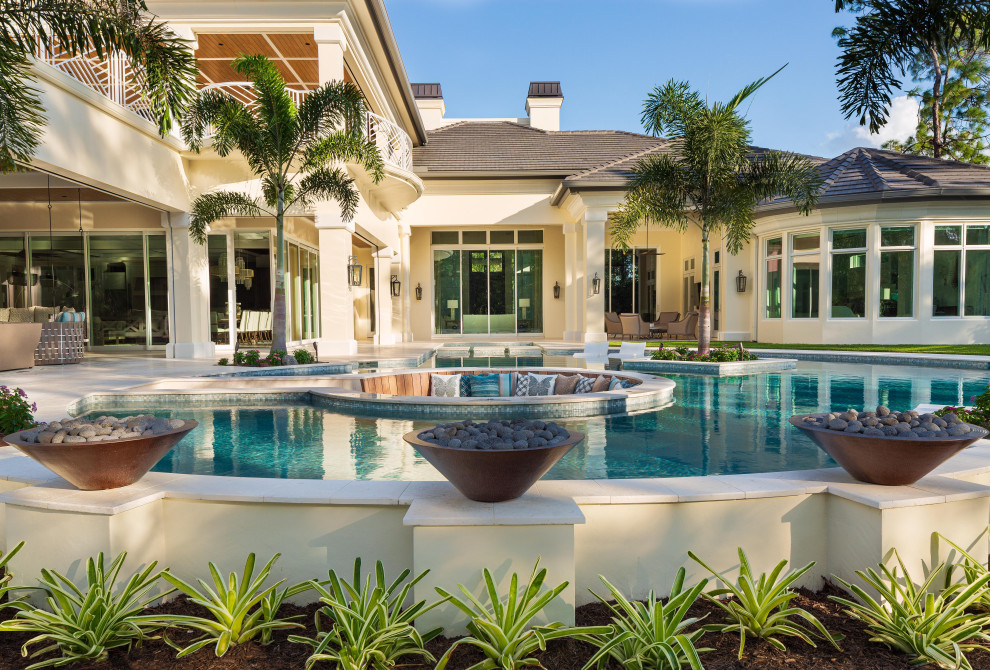 Transitional backyard custom-shaped natural hot tub photo in Miami