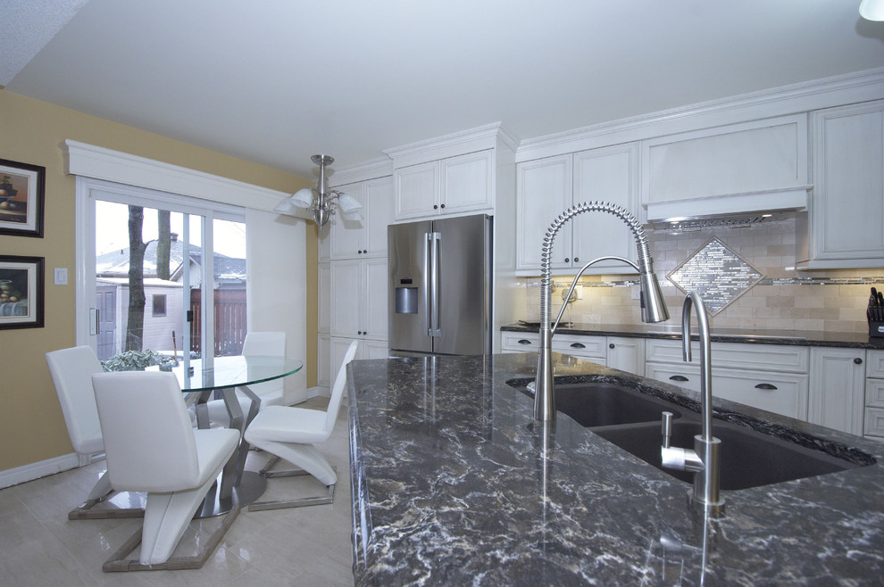 Eat-in kitchen - mid-sized transitional single-wall ceramic tile eat-in kitchen idea in Toronto with a double-bowl sink, recessed-panel cabinets, beige cabinets, quartz countertops, beige backsplash, subway tile backsplash, stainless steel appliances and a peninsula