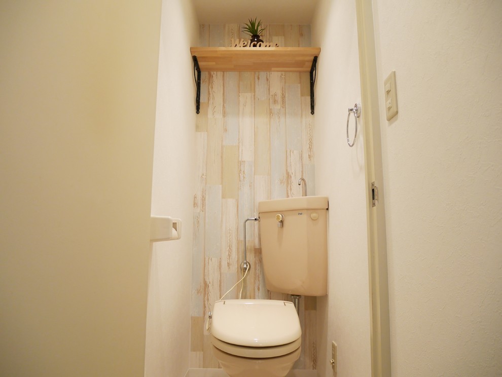 Inspiration for a traditional powder room in Osaka with blue walls.