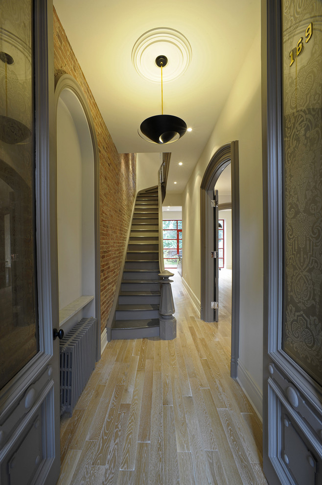 Photo of a contemporary entry hall in New York with a double front door.