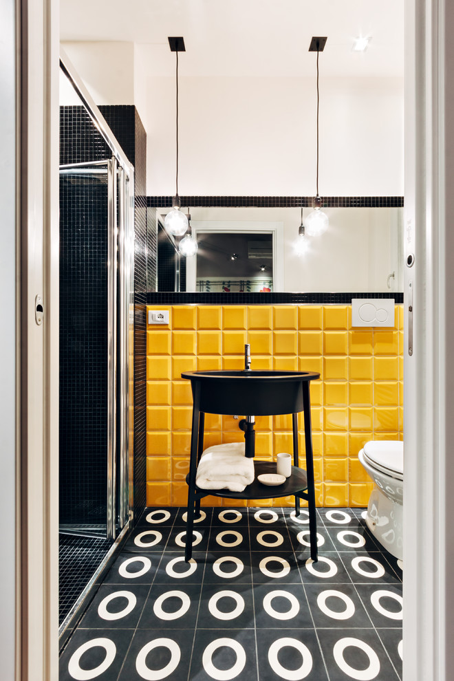 Design ideas for a small contemporary powder room in Other with black cabinets, yellow tile, ceramic tile, concrete floors, black floor and open cabinets.