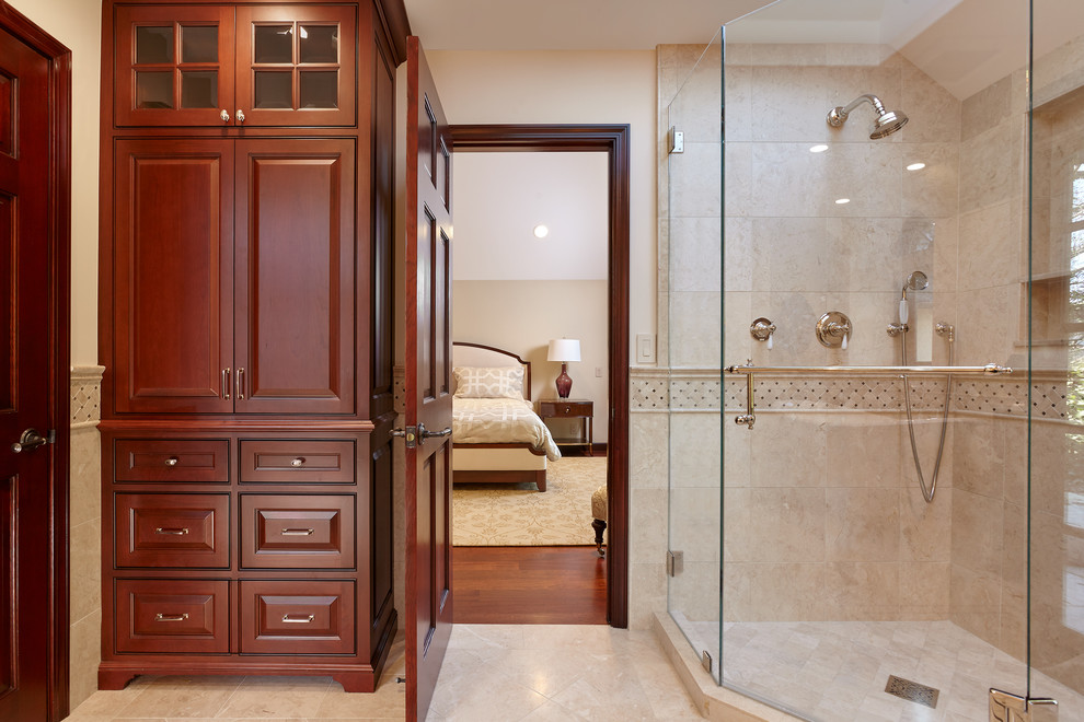 Mid-sized traditional master bathroom in San Francisco with beaded inset cabinets, brown cabinets, a two-piece toilet, gray tile, marble, marble floors, an undermount sink, marble benchtops, a claw-foot tub, a corner shower and beige walls.