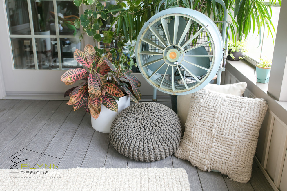 Inspiration for a small beach style sunroom in Cleveland with laminate floors.