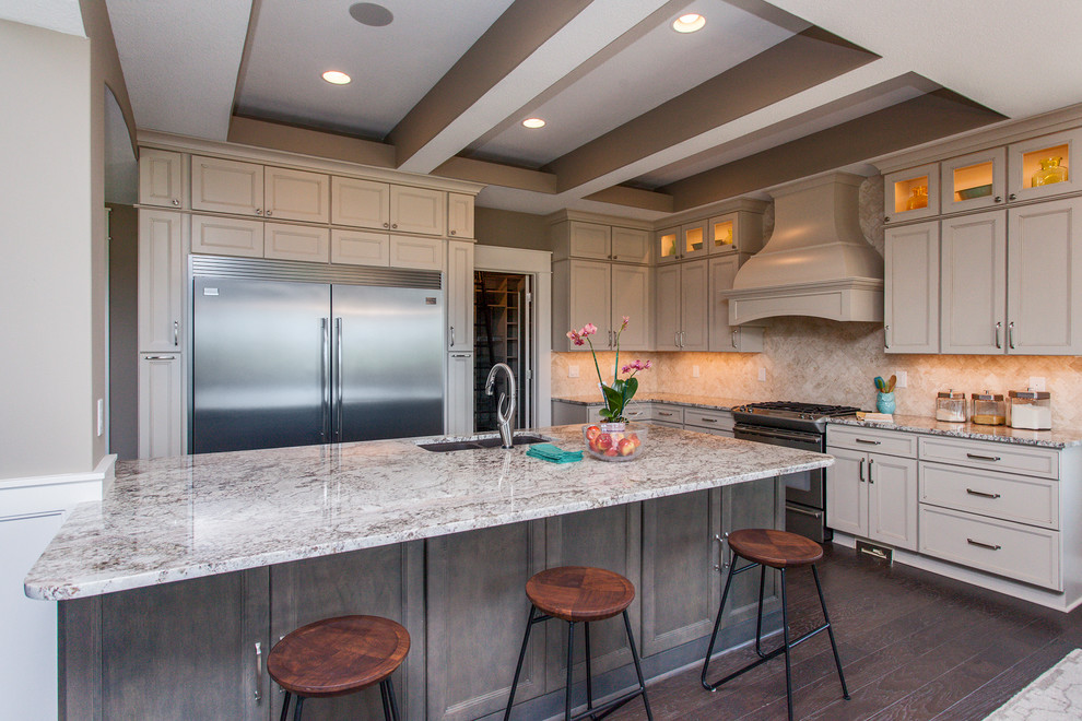 Kitchen - transitional l-shaped kitchen idea with beige backsplash