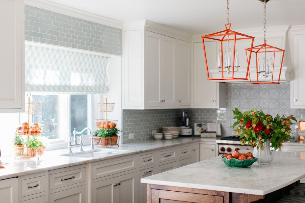 Eat-in kitchen - transitional u-shaped dark wood floor and brown floor eat-in kitchen idea in Chicago with a double-bowl sink, shaker cabinets, white cabinets, quartzite countertops, blue backsplash, ceramic backsplash, stainless steel appliances, an island and white countertops