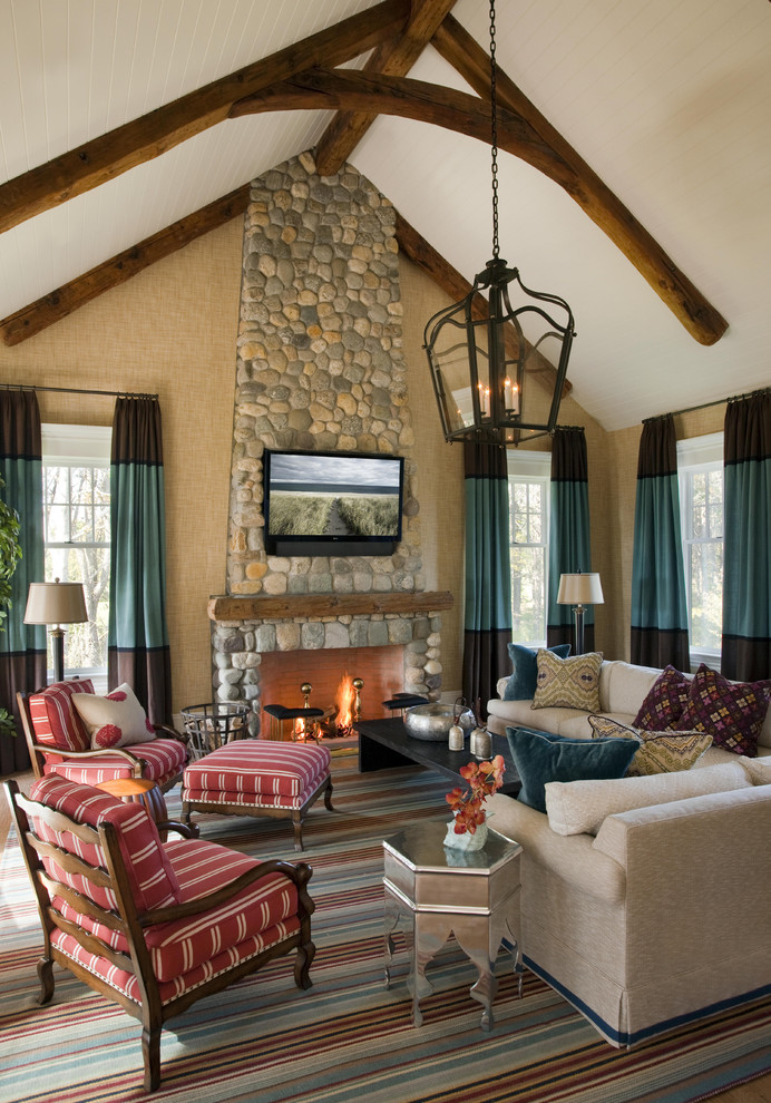 Traditional living room in Boston with a stone fireplace surround.