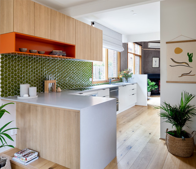 Mixing green and orange in a kitchen.