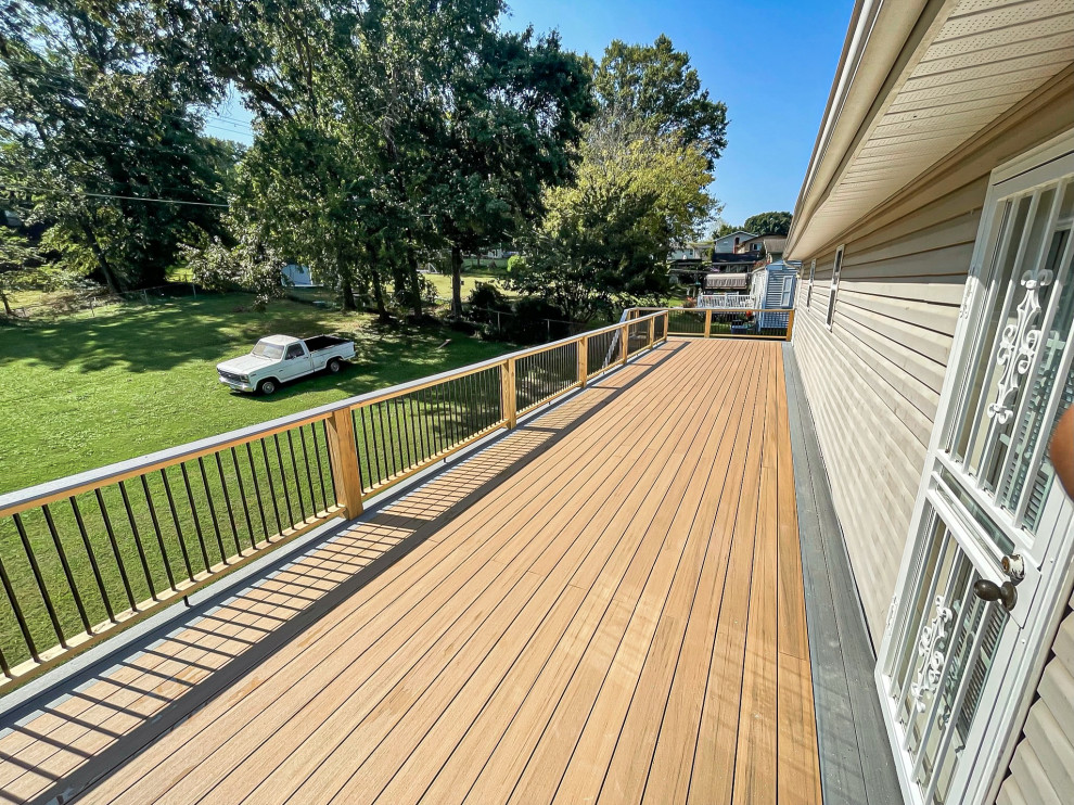 Example of a huge backyard second story mixed material railing deck design