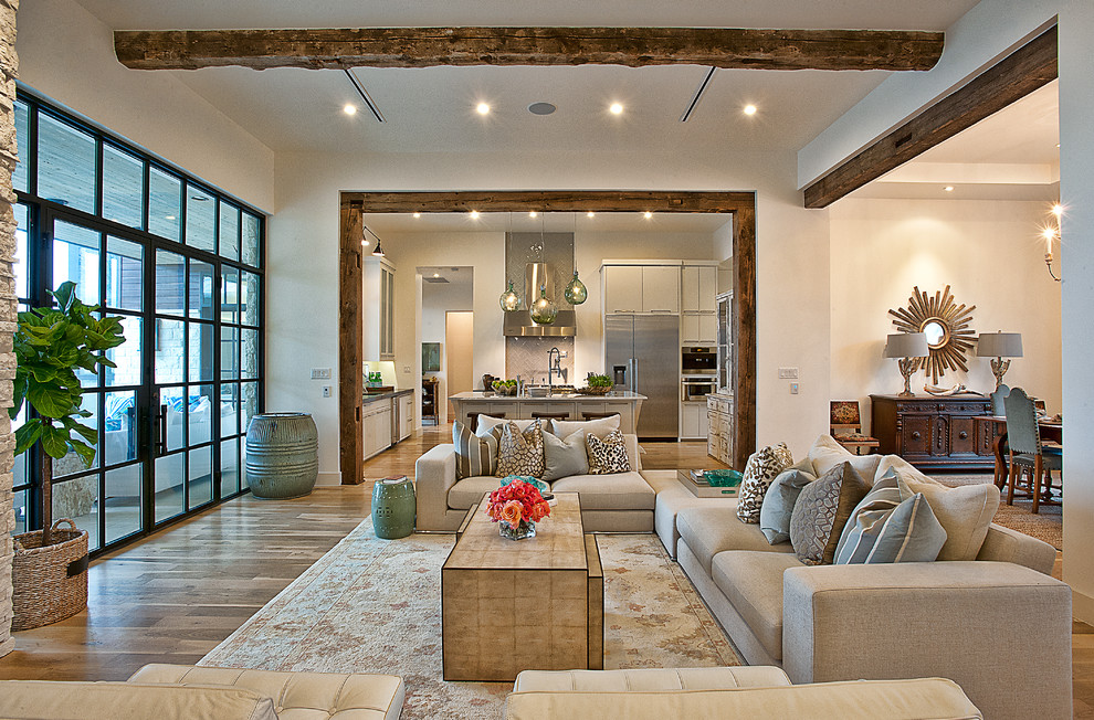 Design ideas for a transitional open concept living room in Austin with white walls.