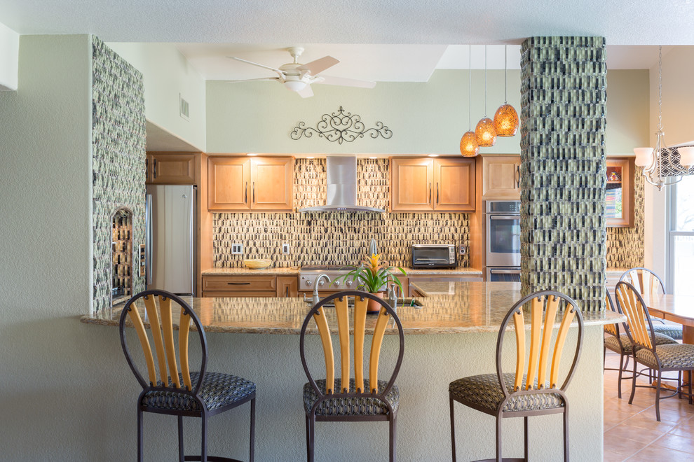 Example of a mid-sized trendy u-shaped porcelain tile open concept kitchen design with an undermount sink, recessed-panel cabinets, light wood cabinets, granite countertops, multicolored backsplash, glass tile backsplash, stainless steel appliances and an island
