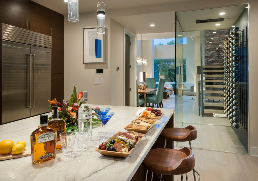 Example of a large trendy l-shaped light wood floor and beige floor kitchen design in Philadelphia with an undermount sink, flat-panel cabinets, dark wood cabinets, marble countertops, white backsplash, marble backsplash, stainless steel appliances and an island