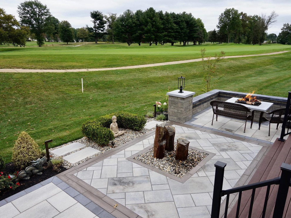 Manalapan, NJ: Contemporary Patio with Tranquil Water Feature & Firepit Area